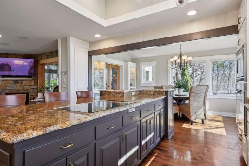 The gleaming solid maple floors go beautifully with the kitchen upgrade!