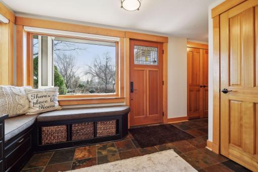 Convenient window seat in the foyer to make it easy for guests
