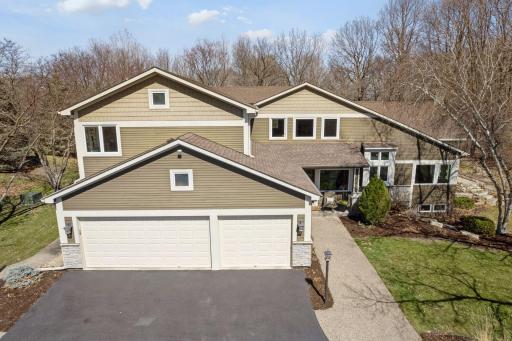 The home features an attached 3-car heated garage with built-in storage area and sink
