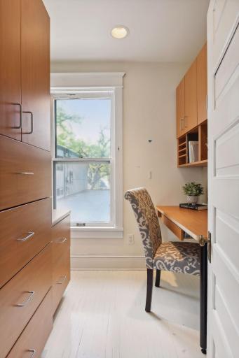 The walk-in closet provides ample storage for clothing and personal belongings, ensuring organization and ease of access for occupants. It also provides a private dedicated work space for homework, crafts, or working from home.