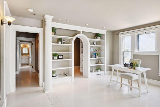 White built-ins add a touch of sophistication and functionality, providing stylish storage solutions while enhancing the room's aesthetic appeal.