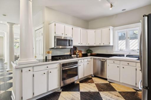 Equipped with state-of-the-art appliances and ample counter space, this kitchen is a chef's dream.
