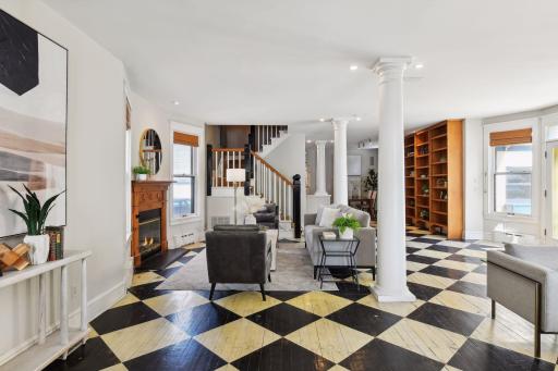 Beautiful open concept design and the mosaic pattern on original oak floors adds whimsy and character