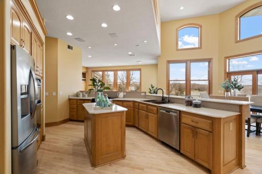 Also, equipped with a pantry closet, under-cabinet lighting, wall/double oven, copper sink, touchless faucet, center island, and peninsula with breakfast bar seating.
