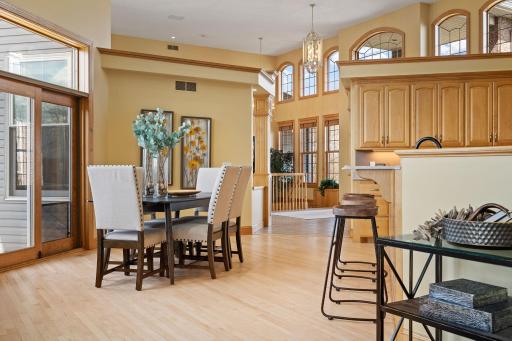 Seamlessly flowing into the adjoining informal dining space with access to the back deck, perfect for hosting gatherings.