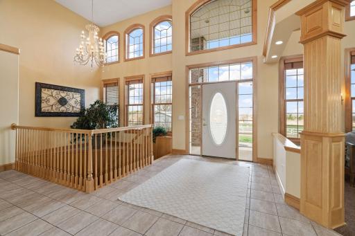 Step into luxury through the grand foyer boasting 16-foot ceilings.