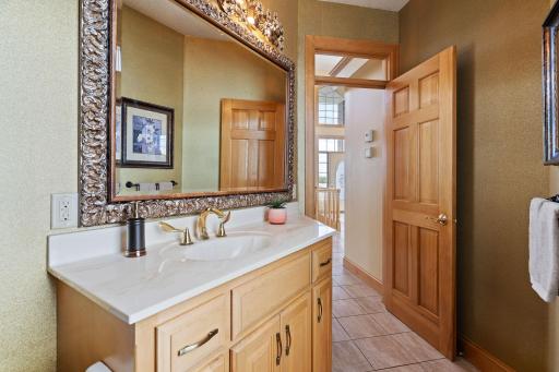 Additionally, a powder room with access to the deck provides easy convenience for guests and pool-goers, enhancing the functionality of outdoor entertainment spaces.