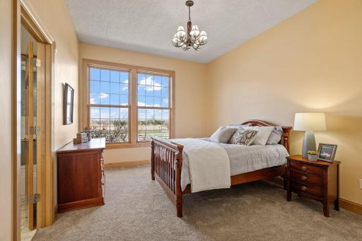 Two additional bedrooms on the main level with front yard views.