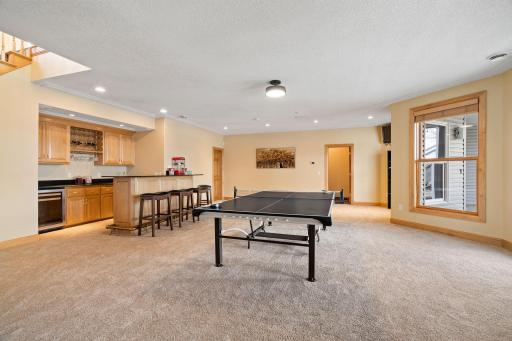 Adjacent recreation room provides access to the backyard patio.
