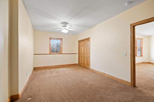 Adjacent to the bedroom is a versatile bonus room, providing endless possibilities for customization, whether as a home gym, office, or hobby space