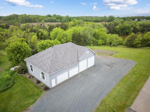 This exceptional property also offers two outbuildings, including an 8-car detached garage with ample storage space.