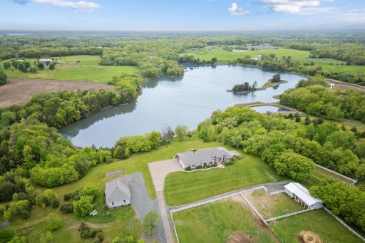 This stunning 18-acre rambler is gracefully positioned on the picturesque shores of Neilsen Lake, offering unparalleled panoramic sunsets that will take your breath away every evening.