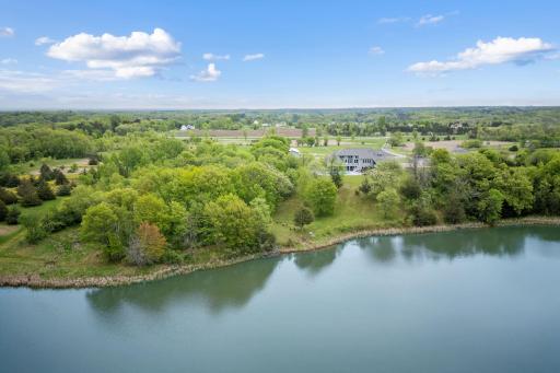 Embrace outdoor living on the expansive deck overlooking the stunning lake views, with private lake access for water enthusiasts.