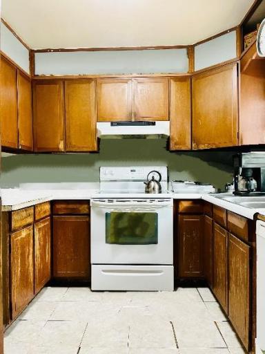 kitchen with glass top stove, oven & hood.jpg