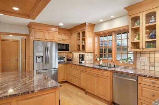 Well appointed kitchen with stainless steel appliances, double ovens and gas range.