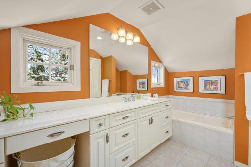 Upper level full bath with separate tub and shower.