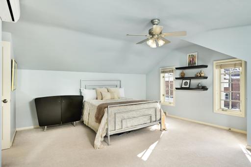 One of two generously sized upper level bedrooms.