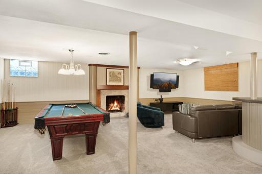 Lower level amusement room with wet bar and room for a pool table.
