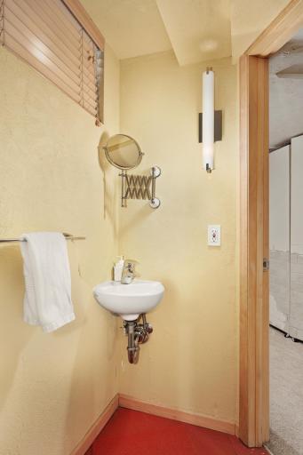 Lower level 1/2 bath just off the gym and wet bar.