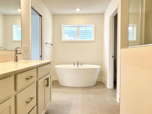 Primary Bathroom of a similar home and floor plan. Options, colors and features may vary.