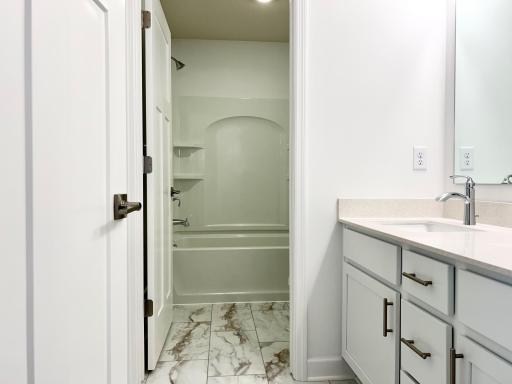 Upstairs Bath of a similar home and floor plan. Options, colors and features may vary.