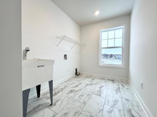 Laundry Room of a similar home and floor plan. Options, colors and features may vary.