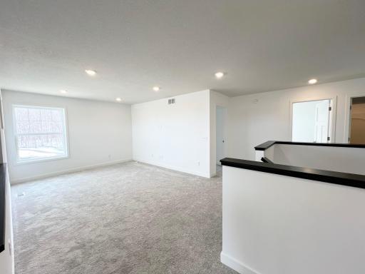 Upper level LOFT space and stairway.