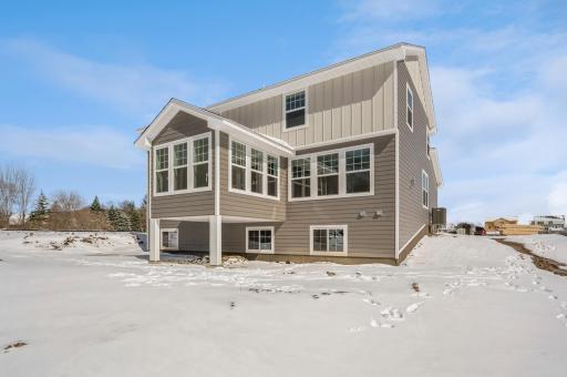 Exterior rear with 4 season porch.