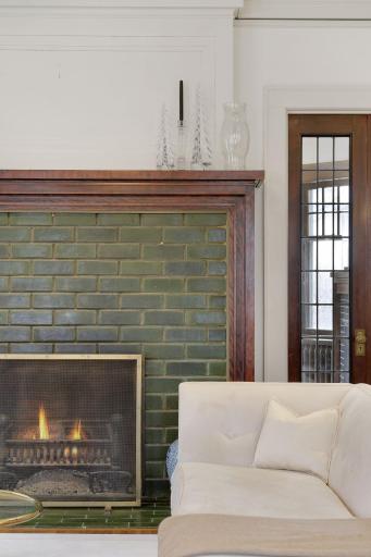 The living room fireplace is flanked by french doors that lead into the main level family room.