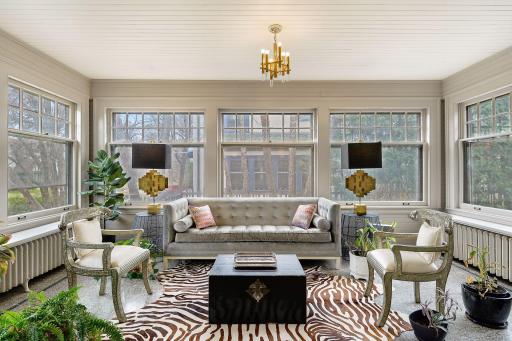 South-facing Sunroom Adjacent to Living Room with Original Terrazzo Floors.