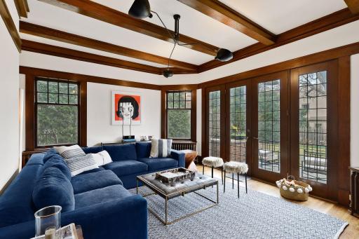 Spacious yet Cozy Family Room Overlooking Backyard with French Doors Out to a Terrace.