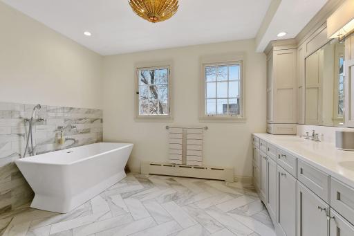 Soaking Tub, Heated Floors, and a Double Vanity with Plentiful Storage and Counterspace.