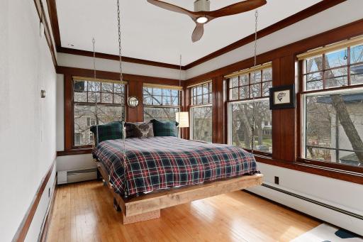 Nap Time! Hidden Sleeping Porch with Hanging Bed Behind Secret Bookshelf off Primary Suite. Enjoy the Four Season Porch Year Round.