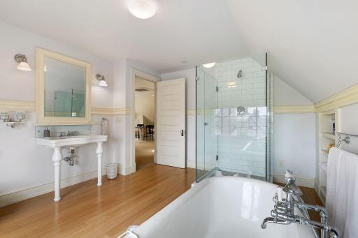 3rd Floor Full Bathroom with Hardwood Floors, Separate Claw-foot Tub, and Walk-in Shower