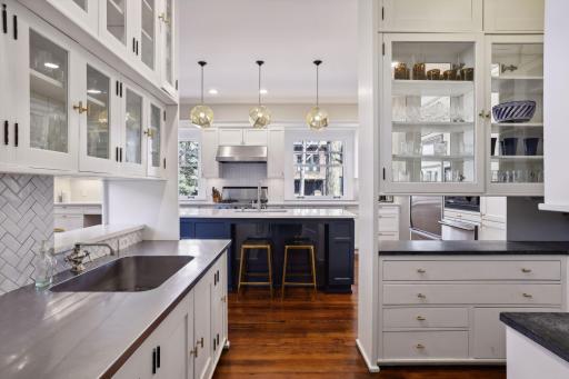 A Spacious Butler's Pantry with Wet Bar connects the Dining Room to the Kitchen. An ideal set-up for entertaining and plentiful storage.