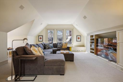 3rd Floor Family Room with Rooftop Deck Access and Built-in Media Center with Mini-Fridge and Microwave for Movie Nights.