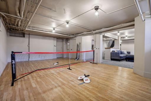 Pickleball? Hockey? Fitness? The lower level also features a 2nd laundry room, powder room, game room, and storage. Walkout access up a set of exterior stairs to the backyard.