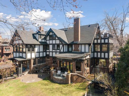 Outdoor Access Off Kitchen & Family Room. The terrace overlooks a level double lot ideal for sports and recreation with a large paver patio and garden beds. A covered walkway connects the garage to the mudroom entrance.