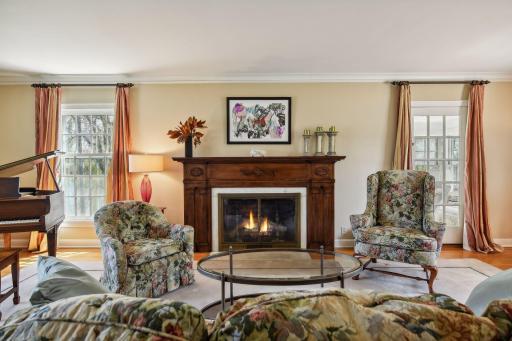 Living room with fireplace and hardwood floors.