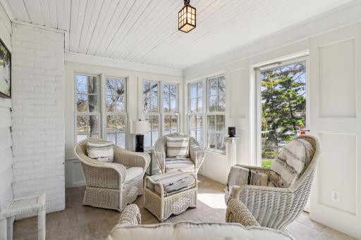 Sun room with 3 sides of windows. New tile flooring.