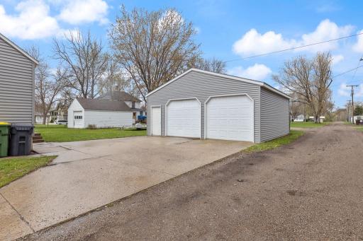 This property includes an oversized detached 2-stall garage with a concrete pad and an additional storage shed