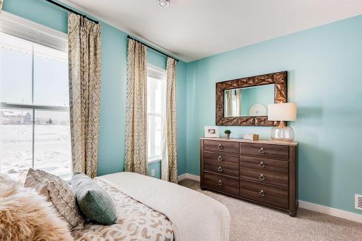 Another view of the front bedroom. Model photo. Options and colors will vary in our available inventory homes.