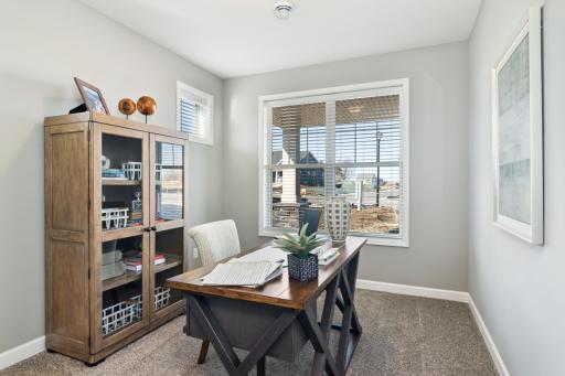 (Photo of completed model home, actual home's finishes vary) The front bedroom is great for an office or guest bedroom and includes a walk-in closet and easy access to the main level full bath.