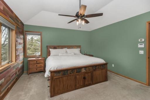 Primary bedroom with feature wall and trayed ceilings. Walk in closet and private full bath complete the suite.