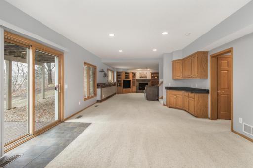 Where do I begin? Walkout lower level with two areas - dry bar in the middle w/ entertainment space beyond. These owners used as a playroom space - could be billiards room? home gym? home office? Added storage in the walk in closet!
