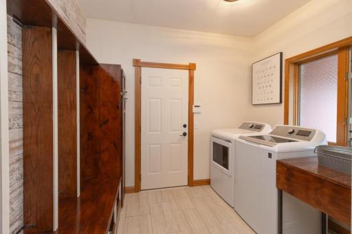 Main floor laundry/mudroom. Wait until you see this built in storage piece! Functional yet trendy and fun!