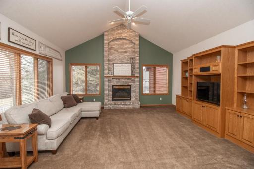 A family room designed for a crew! Lovely vaults, gas burning fireplace and an abundance of built in cabinets!