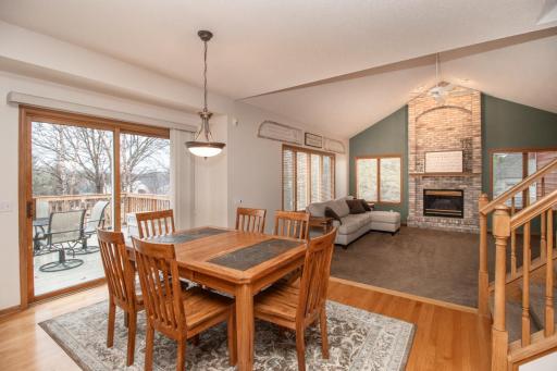 Informal - but amply sized for a crowd - this dining area has convenient deck access and hardwood floors.