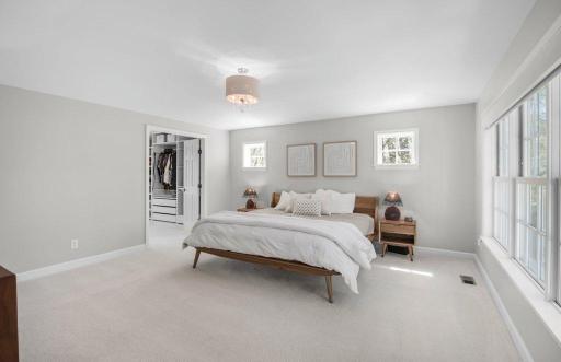 The primary suite is located on the second floor and is remarkably spacious. It features abundant natural light.