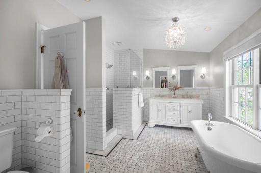 This well-designed bathroom features a separate shower and clawfoot tub. This classic combination adds an air of elegance and luxury to the space.